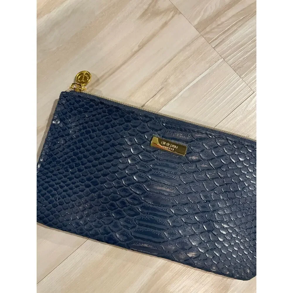 Cle de peau beaute navy snakeskin makeup bag
